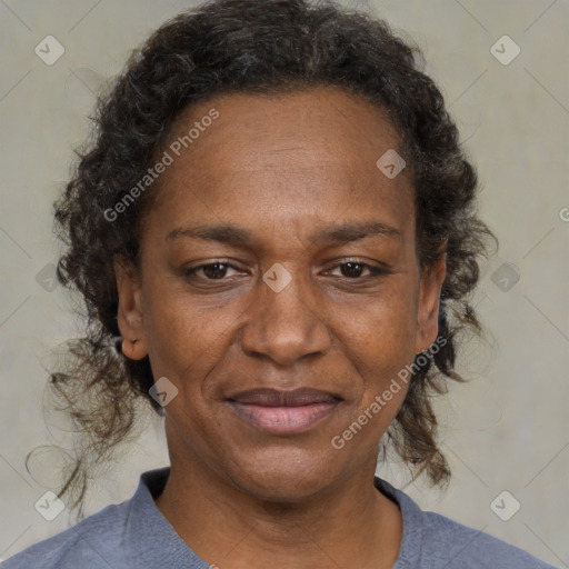 Joyful black adult female with medium  brown hair and brown eyes