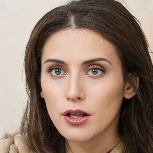 Neutral white young-adult female with long  brown hair and brown eyes