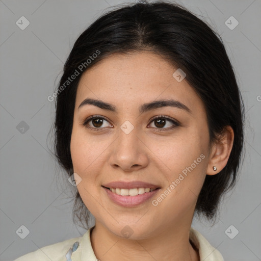 Joyful latino young-adult female with medium  brown hair and brown eyes