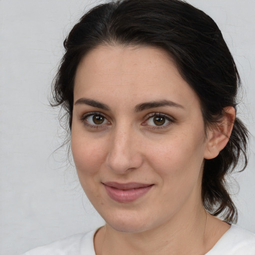 Joyful white young-adult female with medium  brown hair and brown eyes