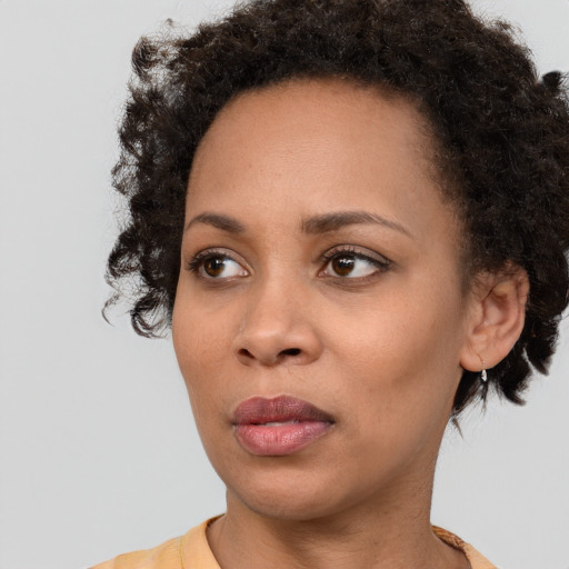 Neutral black young-adult female with short  brown hair and brown eyes