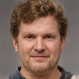 Joyful white adult male with short  brown hair and grey eyes