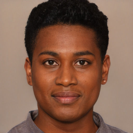 Joyful black young-adult male with short  black hair and brown eyes