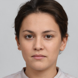 Neutral white young-adult female with short  brown hair and brown eyes