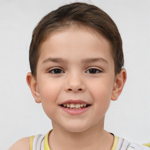 Joyful white child male with short  brown hair and brown eyes