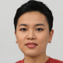 Joyful asian young-adult female with short  black hair and brown eyes