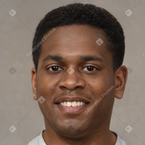 Joyful black young-adult male with short  brown hair and brown eyes