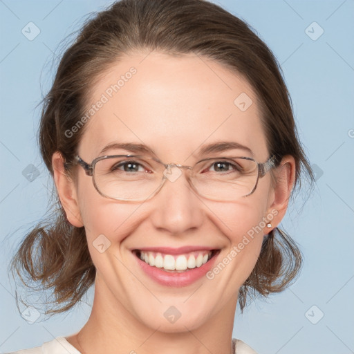 Joyful white adult female with medium  brown hair and grey eyes