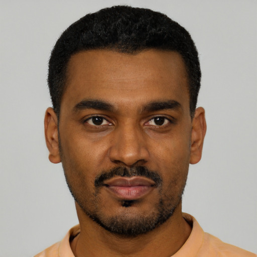 Neutral black young-adult male with short  black hair and brown eyes