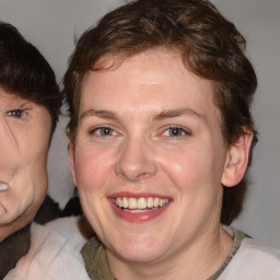 Joyful white adult female with medium  brown hair and blue eyes