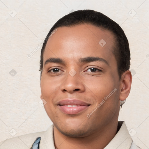 Joyful white young-adult male with short  black hair and brown eyes