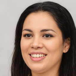 Joyful asian young-adult female with long  brown hair and brown eyes