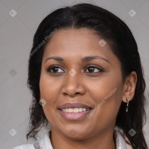 Joyful latino young-adult female with medium  brown hair and brown eyes