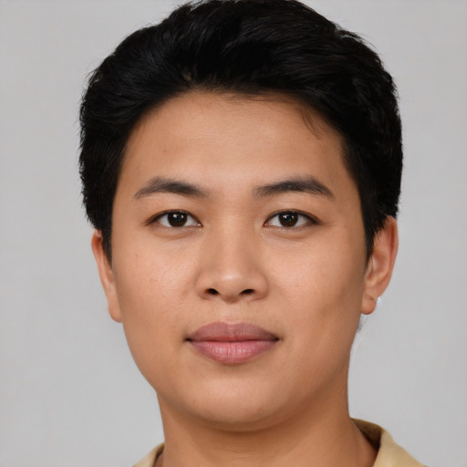 Joyful asian young-adult male with short  black hair and brown eyes