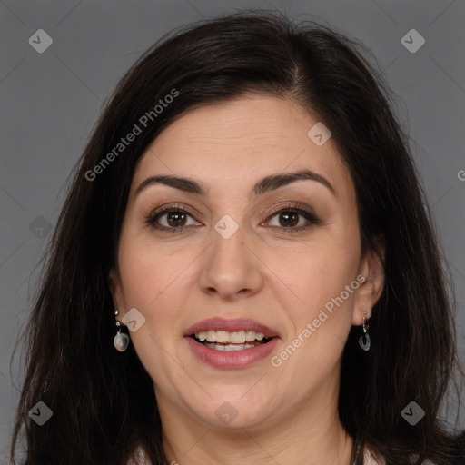 Joyful white adult female with long  brown hair and brown eyes