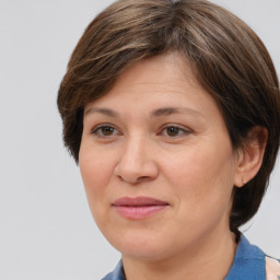 Joyful white adult female with medium  brown hair and brown eyes