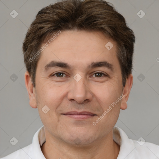 Joyful white adult male with short  brown hair and brown eyes