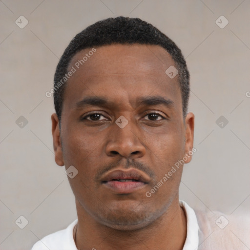 Neutral latino young-adult male with short  black hair and brown eyes