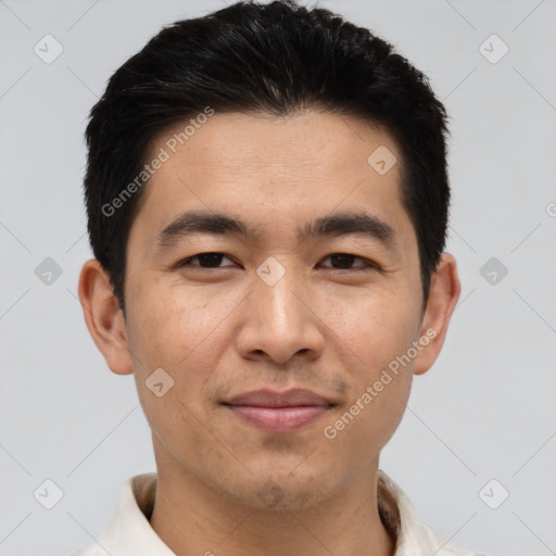 Joyful asian young-adult male with short  black hair and brown eyes