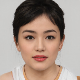 Neutral asian young-adult female with medium  brown hair and brown eyes