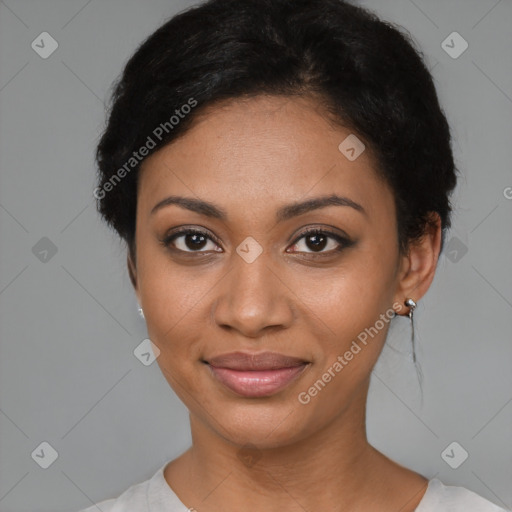 Joyful black young-adult female with short  black hair and brown eyes