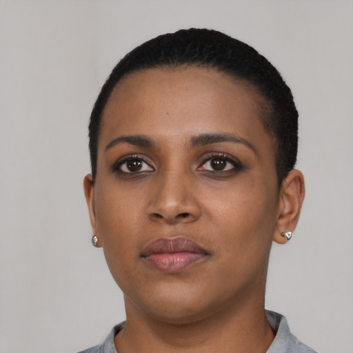 Neutral black young-adult female with short  black hair and brown eyes