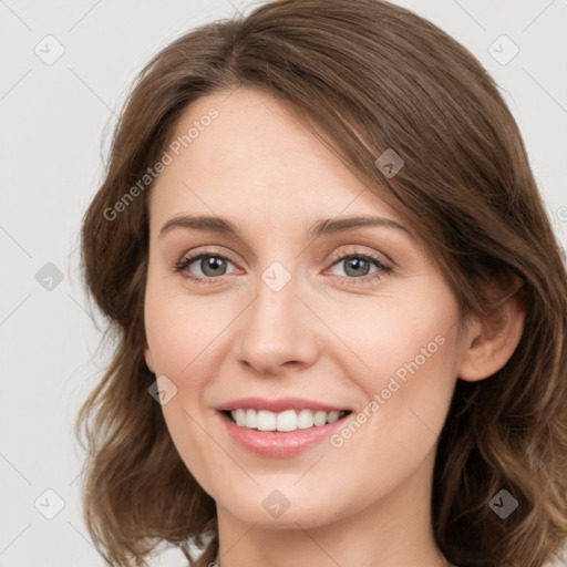 Joyful white young-adult female with medium  brown hair and green eyes