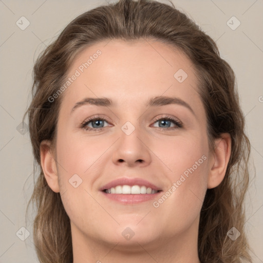 Joyful white young-adult female with medium  brown hair and green eyes