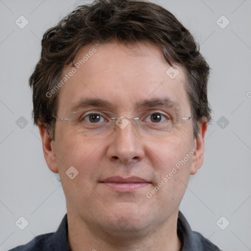 Joyful white adult male with short  brown hair and grey eyes