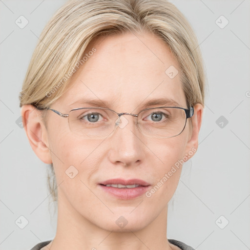 Joyful white adult female with medium  brown hair and blue eyes