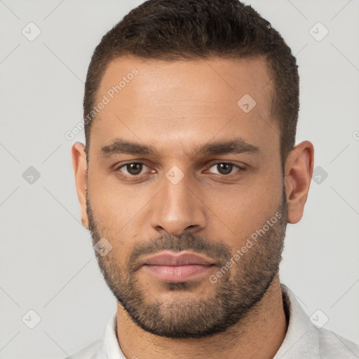 Neutral white young-adult male with short  brown hair and brown eyes