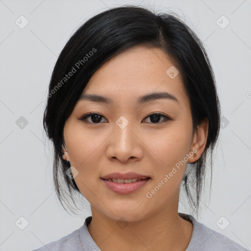 Joyful asian young-adult female with medium  black hair and brown eyes