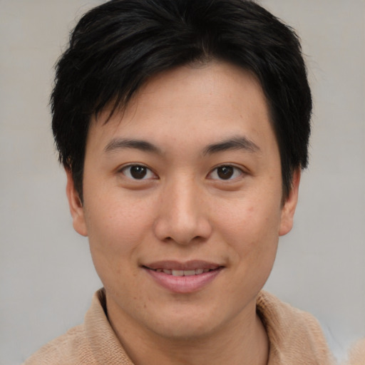 Joyful asian young-adult female with short  brown hair and brown eyes
