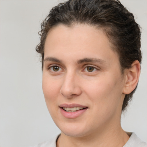 Joyful white young-adult female with medium  brown hair and brown eyes