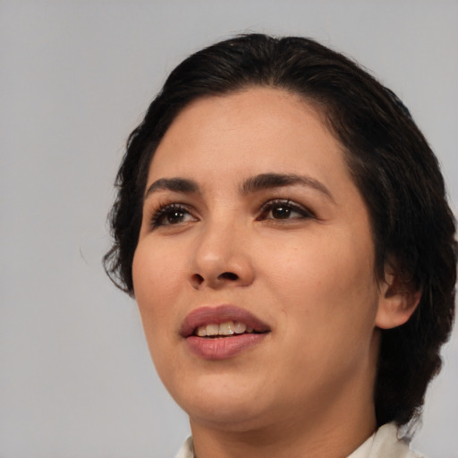 Joyful white young-adult female with medium  black hair and brown eyes