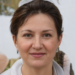 Joyful white adult female with short  brown hair and brown eyes