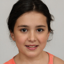 Joyful white child female with medium  brown hair and brown eyes