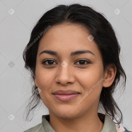 Joyful latino young-adult female with medium  brown hair and brown eyes