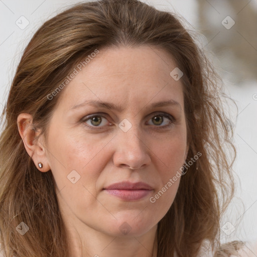 Joyful white adult female with long  brown hair and grey eyes