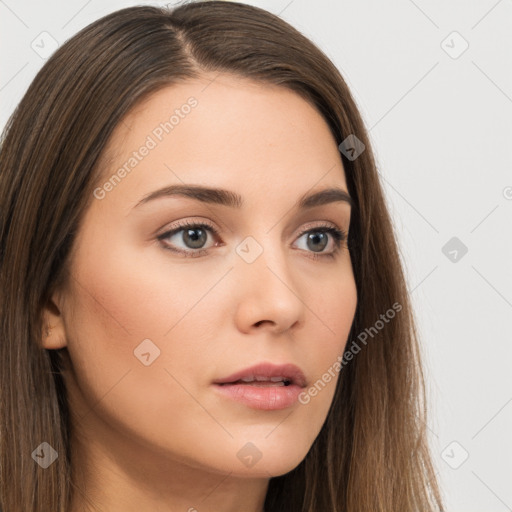 Neutral white young-adult female with long  brown hair and brown eyes