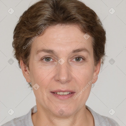 Joyful white adult female with short  brown hair and grey eyes