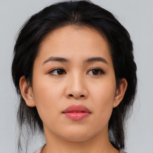 Joyful asian young-adult female with medium  black hair and brown eyes