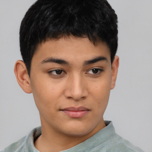 Joyful asian young-adult male with short  brown hair and brown eyes