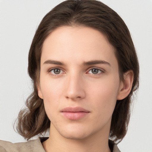 Neutral white young-adult female with medium  brown hair and brown eyes