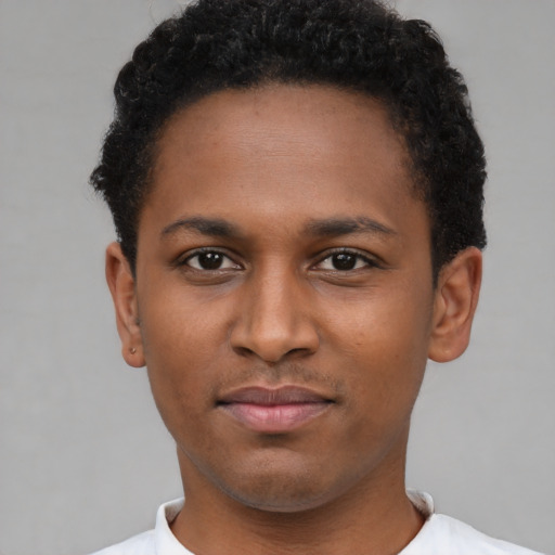 Neutral latino young-adult male with short  brown hair and brown eyes