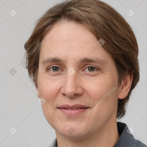 Joyful white adult female with medium  brown hair and grey eyes