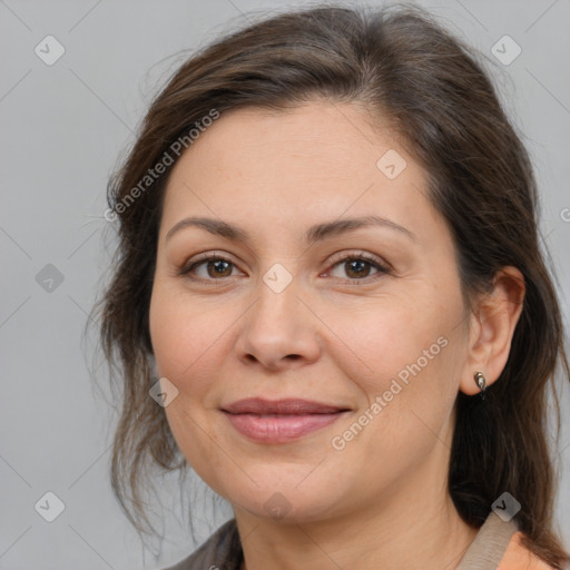 Joyful white adult female with medium  brown hair and brown eyes