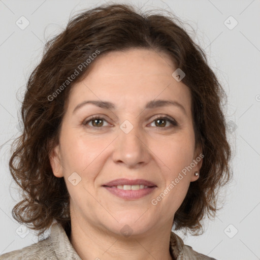 Joyful white adult female with medium  brown hair and grey eyes