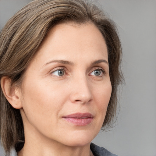 Neutral white adult female with medium  brown hair and grey eyes