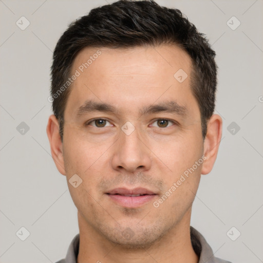 Joyful white young-adult male with short  brown hair and brown eyes